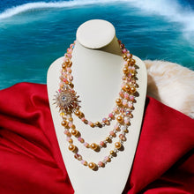 Load image into Gallery viewer, #MultiStrandNecklace
#MulticolorJewelry
#PinkBeadedNecklace
#HandcraftedNecklace
#StatementNecklace
#VibrantJewelry
#BohoChicNecklace
#UniqueNecklace
#ColorfulNecklace
#HandmadeJewelry
#BoldAccessories
#FashionNecklace
#SpecialOccasionJewelry
#ElegantNecklace