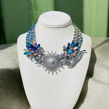 Load image into Gallery viewer, #StatementNecklace
#BlueAndPurpleJewelry
#MulticoloredNecklace
#BoldNecklace
#HandcraftedJewelry
#VibrantJewelry
#BohoChicNecklace
#UniqueNecklace
#ColorfulAccessories
#HandmadeNecklace
#FashionNecklace
#SpecialOccasionJewelry
#ElegantNecklace
#BoldAccessories