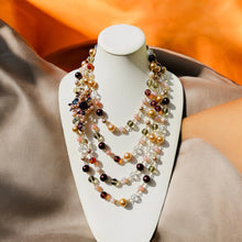 Load image into Gallery viewer, #MultiStrandNecklace
#PinkAndBrownJewelry
#MulticolorBeadedNecklace
#HandcraftedJewelry
#StatementNecklace
#BohoChicNecklace
#VibrantJewelry
#UniqueNecklace
#ColorfulNecklace
#HandmadeNecklace
#EarthTonedJewelry
#FashionNecklace
#SpecialOccasionJewelry
#BoldAccessories