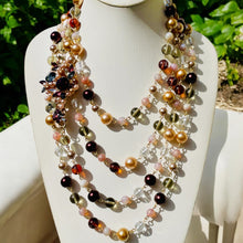 Load image into Gallery viewer, #MultiStrandNecklace
#PinkAndBrownJewelry
#MulticolorBeadedNecklace
#HandcraftedJewelry
#StatementNecklace
#BohoChicNecklace
#VibrantJewelry
#UniqueNecklace
#ColorfulNecklace
#HandmadeNecklace
#EarthTonedJewelry
#FashionNecklace
#SpecialOccasionJewelry
#BoldAccessories