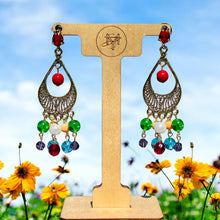 Load image into Gallery viewer, #ChandelierEarrings
#MulticoloredJewelry
#BeadedEarrings
#HandcraftedJewelry
#RedBlueGreenJewelry
#StatementEarrings
#BoldJewelry
#VibrantEarrings
#HandmadeEarrings
#ColorfulAccessories
#SpecialOccasionJewelry
#BohoChicEarrings
#UniqueJewelry
#EveningJewelry