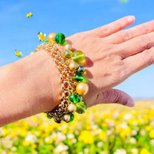 Load image into Gallery viewer, #BeadedBracelet
#CharmBracelet
#GreenAndGoldJewelry
#MulticolorBracelet
#HandcraftedJewelry
#ColorfulBracelet
#GoldJewelry
#UniqueBracelet
#BohoBracelet
#FeminineAccessories
#HandmadeBracelet
#LayeringBracelet
#StatementJewelry
#VersatileAccessories