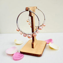 Load image into Gallery viewer, Jewelry stand with pink beaded hoop earrings on a light background