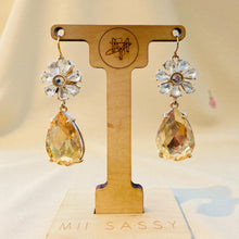Load image into Gallery viewer, Pair of earrings on a wooden display stand with &#39;Mii Sassy&#39; branding.
