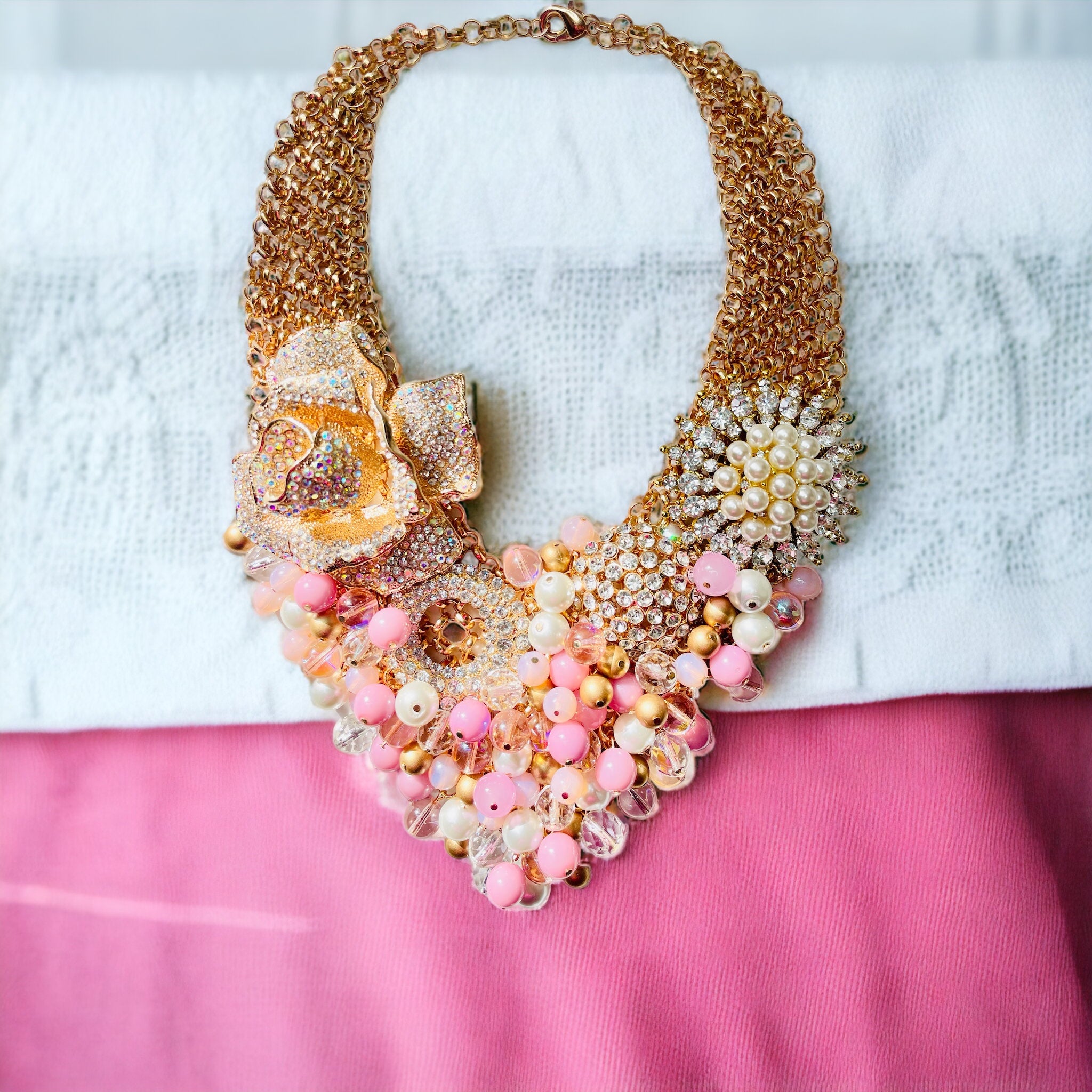 Massive necklace in gold colour, cut pink drop and grains, clear zircons |  Jewellery Eshop EU